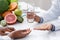 Nutritionist giving pills and glass of water to female patient