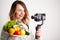 Nutritionist records a video blog about healthy eating on a mobile phone