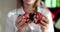 Nutritionist woman holding pomegranate and health benefits and healthy eating