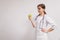 A nutritionist is a young woman holding an apple in her hand. The concept of losing weight in the patient