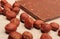 Nutritious chocolate and hazelnuts on wooden table