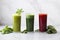 Nutritious and healthy cold-pressed juices in a white kitchen.