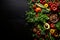 Nutritious veggies and fruits in flat lay arrangement, top view, on dark solid background