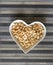 Nuts arranged in heart  on background. Healthy Food image close up cashew nuts. Love Texture