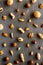 Nuts background - with almond, macadamia, walnut - on grey table top-down