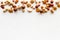Nuts background - with almond, macadamia, walnut - on white table top-down frame copy space