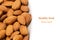 Nuts border of almonds on white background.