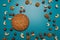 Nuts and cookies with empty place for text. Studio image. Homemade cookies with set nuts on a blue background.
