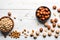 Nuts Galore: A Flat Lay of Mixed Hazelnuts, Cashews, and Almonds on a White Background