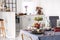 Nuts, grapes and apples on dining table with wine glasses and plate with tableware