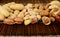 Nuts in line-peanuts,walnuts,pistachios,brasil nuts on brown mat