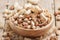 Nuts set assortment in bowl with almonds, pistachios, cashews, hazelnuts, peanuts, Brazil nuts, walnuts, vintage wooden kitchen