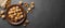 Nuts. Walnut kernels and whole walnuts on dark stone table.