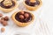 Nutty chocolate dessert small tarts closeup