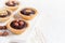 Nutty chocolate dessert small tarts on a white background, spac