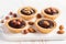 Nutty dessert - small tarts with different nuts and chocolate