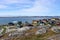 Nuuk, capital of Greenland. Town in Greenland with colorful houses on the shore of the bay where an iceberg floats