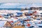 Nuuk city covered in snow with sea and mountains