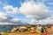 Nuuk city old harbor fjord panorama with clouds over the blue sky in the background, Greenland