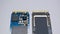 NVME M2 SSD disks for data storage at high speed closeup on isolated background. Comparision view focused at the pinpoint.