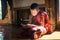 NYAUNGSHWE, MYANMAR - OCT 05 2014: Myanmar novice reading the book in the Shwe Yaunghwe Kyaung monastery.