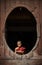 NYAUNGSHWE, MYANMAR - OCT 05 2014: Myanmar novice reading the book in the Shwe-Yaunghwe monastery.