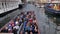 Nyhavn canal with floating tour boat which full of tourists and background of colourful iconic townhouses.