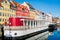 Nyhavn pier with buildings, ships, yachts and other boats in the Old Town of Copenhagen, Denmark