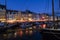 Nyhavn water front canal and touristic street at night