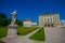 Nymphenburg, Germany - July 30, 2015: Beautiful palace as seen from distance with statues on both sides of avenue