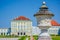 Nymphenburg, Germany - July 30, 2015: Palace building shot from artistic angle with sculpture visible up close, beautiful blue sky