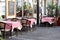 NYON, SWITZERLAND - APRIL 27, 2018: outdoor tables in cozy swiss restaurant in Nyon city