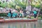 Oahu, Hawaii - 4/26/2018 - Hawaiian dancers performing while riding a canoe float at the Polynesian Cultural Center in Hawaii