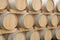 Oak barrels lined up in a cellar Bordeaux wine