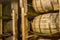 Oak bourbon barrels on rack in warehouse