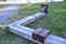 Oak gray wood without impregnation wood on the terrace is folded and connected by steel clips like a park bench. the bench include