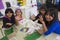Oak View, California, USA, December 15, children doing finger painting after school