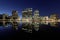 Oakland skyline panoramic view with Lake Merritt Reflections at blue hours.