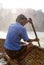 An oar man oaring his coracle at Hogenakkal Falls