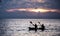 Oarsman silhouette with sunset