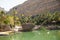 Oasis with emerald water color at Wadi Bani Khalid