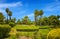 Oasis landscape in the Marrakesh, Morocco. Beautiful garden with date palms near Koutoubia Mosque minaret . Adventure travel