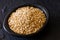 Oat Avena sativa grains in a black clay dish