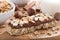 Oat bar with chocolate on wooden board, selective focus