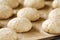 Oat bread buns on baking sheet