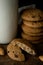 Oat cookies with chocolate, almond, white glass on cutting board. Vertical photo