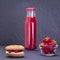 Oat cookies with raspberry, soft cheese, honey and raw raspberry and red juice on the background of black slate , close up