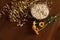 Oat ears stems and oat flakes in a bowl on a dark brown wood background. Top view. oat flakes small size grind. Flower of calendul