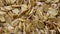 Oat flakes in bulk rotate, top view, spinning slowly in a circle, close up.