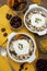 Oat flakes with nuts, dried fruit mix in bowl over rustic wooden table, isolated. Healthy breakfast food